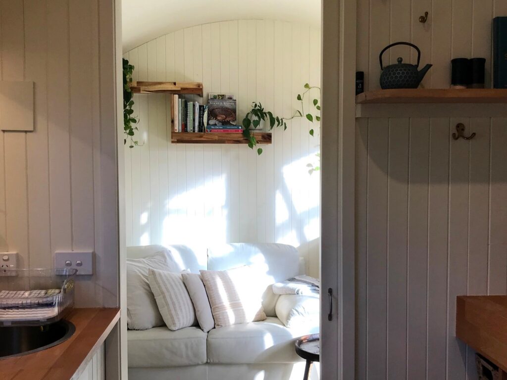 Comfortable living room inside Holly Tree Hut with rustic decor