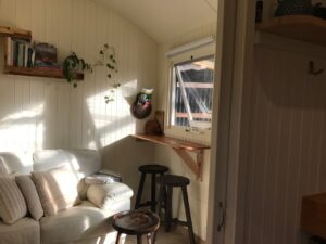 Warm and inviting interior of Holly Tree Hut with wooden decor