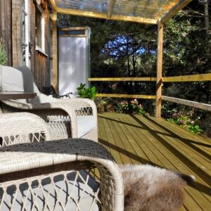 Enjoy the sun on the deck at Holly Tree Hut Bruny Island